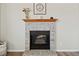 Close-up of a charming fireplace with a decorative mantel and brick surround at 180 S Carlton St, Castle Rock, CO 80104