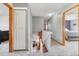 Hallway view featuring a staircase leading to the lower level at 180 S Carlton St, Castle Rock, CO 80104