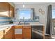 Bright kitchen with stainless steel appliances and wood cabinets at 180 S Carlton St, Castle Rock, CO 80104