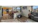 Inviting living area showcasing wood floors, dining table, and sun-filled windows at 180 S Carlton St, Castle Rock, CO 80104