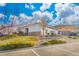 A well-maintained exterior view of a community building with beautiful landscaping and plenty of parking at 5537 Lewis Ct # 1, Arvada, CO 80002