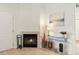 Bright living room features fireplace with white mantel, light wood floors and stylish decor at 5537 Lewis Ct # 1, Arvada, CO 80002