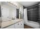Bathroom featuring black shower tiling and vanity at 3076 W 112Th Ct # C, Westminster, CO 80031