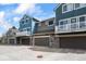 Stylish townhomes with attached garages, stone accents, private balconies, and well-maintained surroundings at 3076 W 112Th Ct # C, Westminster, CO 80031