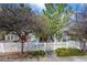 Charming home with a white picket fence, beautiful trees, and a well-manicured front yard at 3076 W 112Th Ct # C, Westminster, CO 80031
