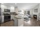 Well-lit kitchen with modern appliances and view to living room with a fireplace at 3076 W 112Th Ct # C, Westminster, CO 80031