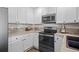 Detailed view of the kitchen featuring modern appliances at 3076 W 112Th Ct # C, Westminster, CO 80031