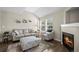Comfortable living room features a cozy fireplace and stylish decor at 3076 W 112Th Ct # C, Westminster, CO 80031