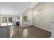 Bright living room featuring a fireplace, wood floors, and modern lighting fixtures at 3076 W 112Th Ct # C, Westminster, CO 80031