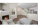 Cozy living room with a fireplace and staircase access, perfect for entertaining at 3076 W 112Th Ct # C, Westminster, CO 80031