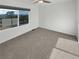 Bedroom with carpet, a ceiling fan, and large picture window overlooking the mountains at 6400 N Windfield Ave, Parker, CO 80134