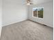 Bright bedroom features a ceiling fan and a large window offering natural light and outdoor views at 6400 N Windfield Ave, Parker, CO 80134