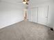 Bedroom featuring neutral carpet and closet with mirrored sliding doors at 6400 N Windfield Ave, Parker, CO 80134