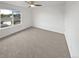 Bright bedroom with neutral carpet and a view of greenery at 6400 N Windfield Ave, Parker, CO 80134