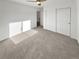 Bedroom featuring neutral carpet and closet with sliding doors at 6400 N Windfield Ave, Parker, CO 80134