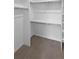 Spacious closet with wood look floors and metal hanging racks at 6400 N Windfield Ave, Parker, CO 80134