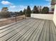 Spacious deck with gray composite decking and black railing offers scenic views of surrounding landscape at 6400 N Windfield Ave, Parker, CO 80134