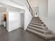 Open entryway featuring modern staircase and wood floors at 6400 N Windfield Ave, Parker, CO 80134