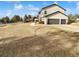 Two-story home with attached garage and landscaped front yard at 6400 N Windfield Ave, Parker, CO 80134