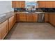 Kitchen featuring granite countertops, stainless steel appliances, and wooden cabinetry at 6400 N Windfield Ave, Parker, CO 80134