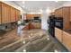 Spacious kitchen featuring custom cabinets, granite counters, and modern appliances at 6400 N Windfield Ave, Parker, CO 80134