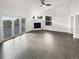 Spacious open floor plan featuring abundant natural light and a modern fireplace at 6400 N Windfield Ave, Parker, CO 80134