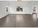 Living room with hardwood flooring and natural light at 6400 N Windfield Ave, Parker, CO 80134