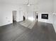 Bright living room with hardwood floors, fireplace, large windows, and ample natural light at 6400 N Windfield Ave, Parker, CO 80134