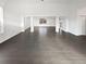 Spacious open-concept living area with hardwood flooring and neutral tones at 6400 N Windfield Ave, Parker, CO 80134