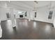 Spacious living room boasts hardwood floors, natural light, and a cozy fireplace at 6400 N Windfield Ave, Parker, CO 80134
