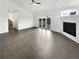 Living room with sliding glass doors, and fireplace at 6400 N Windfield Ave, Parker, CO 80134