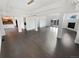 Bright open living room features hardwood floors, modern lighting, and a fireplace at 6400 N Windfield Ave, Parker, CO 80134