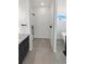 Luxurious glass-door shower featuring stylish black fixtures and elegant white-patterned tiling at 6400 N Windfield Ave, Parker, CO 80134