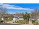 Aerial view of a well-manicured home nestled within a residential neighborhood with mature trees at 3350 S Forest St, Denver, CO 80222