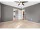 Spacious bedroom features neutral carpet, a ceiling fan, and a mirrored closet at 3350 S Forest St, Denver, CO 80222