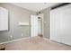 Cozy bedroom with neutral carpet, small floating shelf, and closet for storage at 3350 S Forest St, Denver, CO 80222