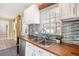 Well-lit kitchen featuring modern countertops and a view into the living area at 3350 S Forest St, Denver, CO 80222