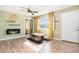 Cozy living room with modern fireplace and hardwood floors at 3350 S Forest St, Denver, CO 80222
