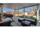 Covered patio features plenty of seating and a view of the fenced backyard at 3350 S Forest St, Denver, CO 80222