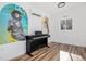 Bright room features laminate wood floors and a mini split air conditioner at 3350 S Forest St, Denver, CO 80222