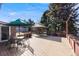 Inviting back deck featuring a gazebo, dining area, string lights, and an umbrella-covered table set at 6261 S Adams Dr, Centennial, CO 80121