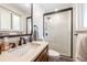 Updated bathroom with a glass shower, quartz counters and a designer faucet at 6261 S Adams Dr, Centennial, CO 80121