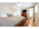 Comfortable bedroom with hardwood floors, a large bed, and a walk-in closet at 6261 S Adams Dr, Centennial, CO 80121