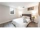 Cozy bedroom with a queen sized bed, side tables and a window at 6261 S Adams Dr, Centennial, CO 80121