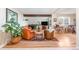Inviting living room with hardwood floors, comfortable seating, and bright natural light at 6261 S Adams Dr, Centennial, CO 80121