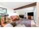 Bright living room with hardwood floors, an area rug, and large leather furniture at 6261 S Adams Dr, Centennial, CO 80121