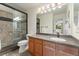 Bathroom featuring tiled shower and spacious wood vanity at 3780 S Quemoy Way, Aurora, CO 80018