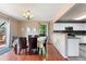 Elegant dining area with table, chandelier and sliding door to the patio at 3780 S Quemoy Way, Aurora, CO 80018