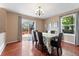 Elegant dining area with table, chandelier and sliding door to the deck at 3780 S Quemoy Way, Aurora, CO 80018