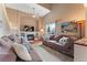 Bright and airy living room with a fireplace and comfortable seating area at 3780 S Quemoy Way, Aurora, CO 80018